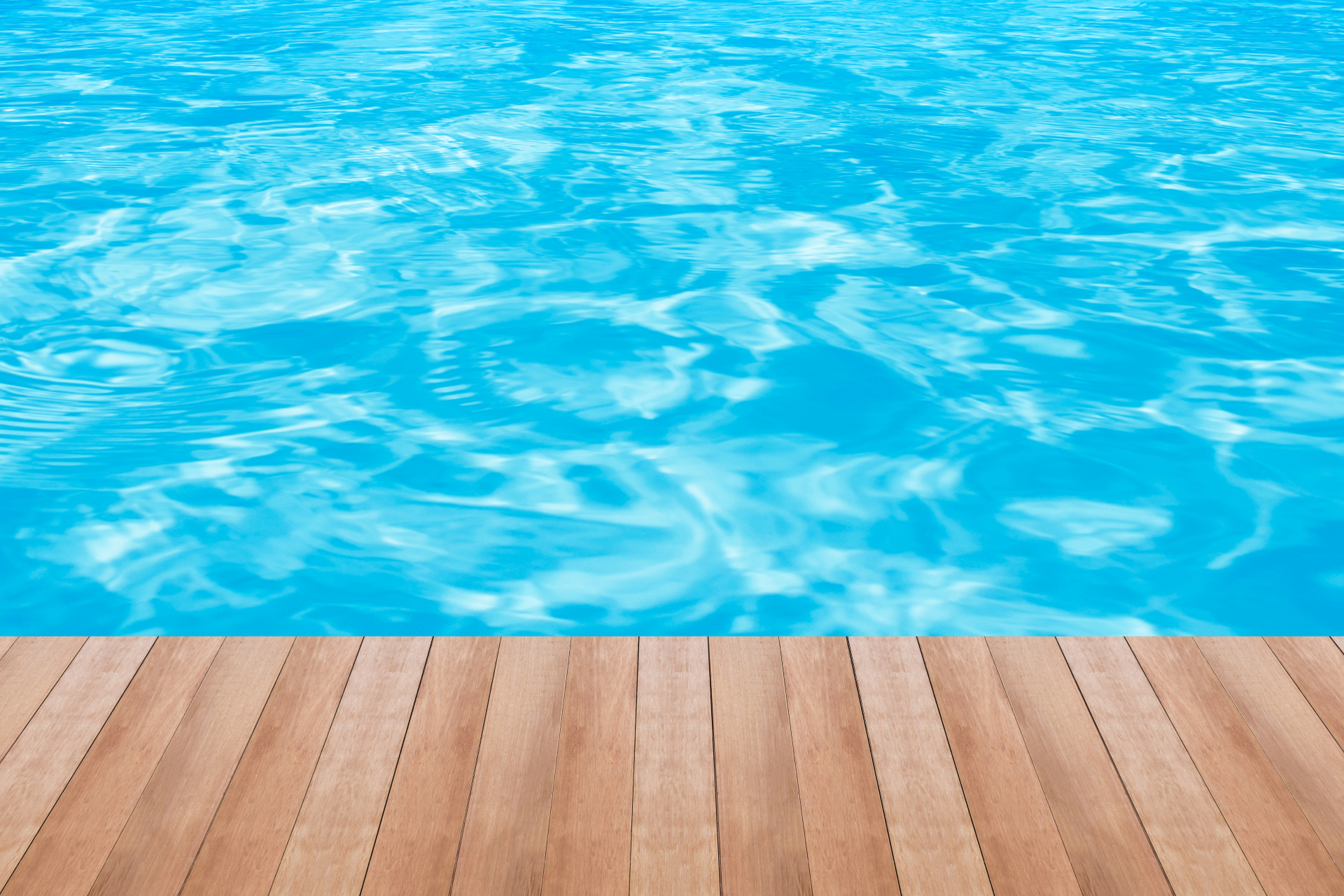 Swimming pool water with a deck along the bottom edge.